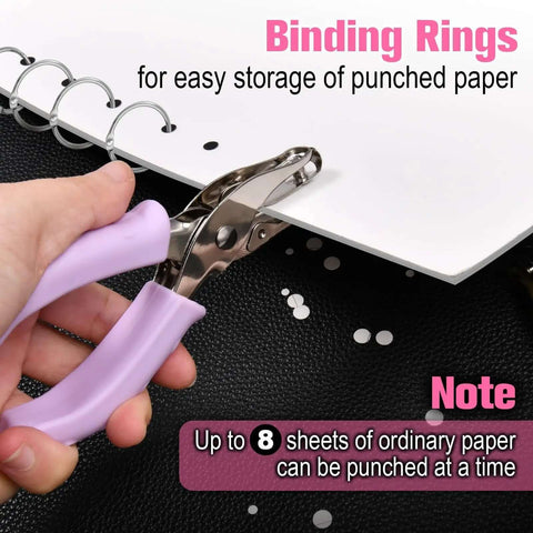 Two Pack Handheld Hole Punch Set With 1/8 Inch And 1/4 Inch Holes Includes 10 Binder Rings Heavy Duty Metal Punches For Crafts Tags Tickets And Paper Projects in use with purple handle example
