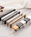 Assorted square bar cabinet pull handles on marble countertop, including Oil Rubbed Bronze 10 Inch Square Bar Cabinet Pull Handle With 10 Inch Hole Centers Zinc Alloy Smooth Curved Back For Drawer Dresser Vanity Cupboard Bedroom Includes 1 Inch And 1-1/2 Inch Screws