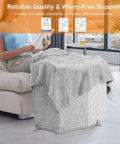 Person sitting with Foldable Under Desk Heater With Blanket Cozy Five Fold Plus Size Eight Temperature Levels Leg And Foot Warmer