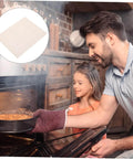 Father and daughter using oven with 10 Pack Microwave Mica Plate Sheets For Oil Splash Prevention And Heat Insulation In Microwave Ovens.