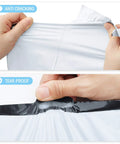 Hands testing 10x13 white poly mailers showing anti-cracking and tear-proof durability, 200 pack self sealing shipping envelopes.
