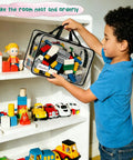 Child placing toy blocks into 6 Pack Large Clear Toy Storage Bags With Double Zippers Travel Organizer Pouch Waterproof PVC With Handles