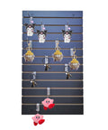 24 By 40 Inch Black Slatwall Panel For Home Garage And Retail Display, Flexible Wall Organizer For Tools With Hooks Shelves And Brackets, Durable Slatwall Panel For Customizable Merchandising shows hanging plush toys.