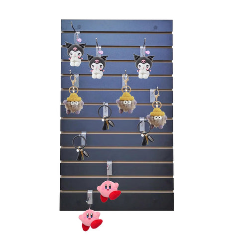 24 By 40 Inch Black Slatwall Panel For Home Garage And Retail Display, Flexible Wall Organizer For Tools With Hooks Shelves And Brackets, Durable Slatwall Panel For Customizable Merchandising shows hanging plush toys.