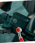 Motorcycle handlebar with visible Flexible Brake Line Hose for Motorcycles, Scooters and Dirt Bikes, red sleeve close-up