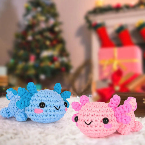 Blue and pink crochet axolotls from All In One Beginner Crochet Kit With Axolotl Pattern And Video Tutorials For Adults And Teens Starter