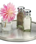 Slick Brushed Stainless Steel Lazy Susan Turntable with spice jars and a flower, 10.5 inches wide, perfect for kitchen storage.