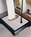 Person stepping on Portable Indoor Outdoor Mobility Step Stool For Easy Entry Into Home Tub Or Car, Slip Resistant Rubber Tread With Drainage Holes, Lightweight Just 3.6 Lbs, Supports Up To 440 Lbs, 19.25 Inches Long, Perfect Size For Doorways