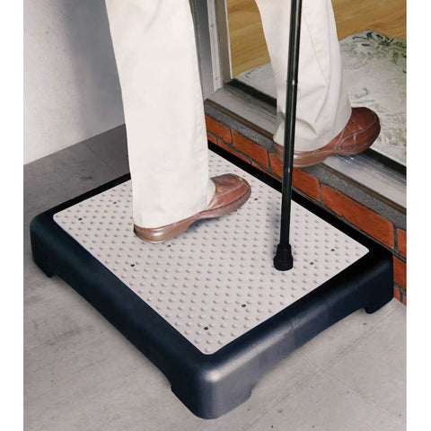 Person stepping on Portable Indoor Outdoor Mobility Step Stool For Easy Entry Into Home Tub Or Car, Slip Resistant Rubber Tread With Drainage Holes, Lightweight Just 3.6 Lbs, Supports Up To 440 Lbs, 19.25 Inches Long, Perfect Size For Doorways