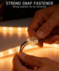 Hand using 150 Pcs Double Wire Plug In Connector With Locking Buckle And Quick Clip Fasteners for DIY strip lights