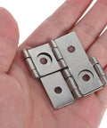 Four Pack Retro Iron Hinges With Dope Vintage Vibe Square Cabinet Hinges held in hand