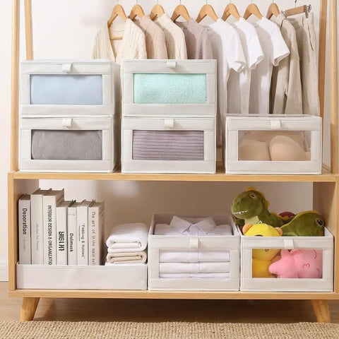 4 Pcs Foldable Closet Storage Bins With Clear Window For Slick Organization And No Sweat Folding To Keep Your Wardrobe Tidy And Make Room Organization A Total Breeze, on wooden shelf with clothes and books.