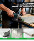 Man using handheld angle grinder on concrete slab, equipped with Dust Shroud For Angle Grinder 4.5 To 5 Inch With 360 Degree Detachable Connector Universal Fit Includes 2 Pack 5 Inch Diamond Cup Wheels Keeps Dust Down On Concrete Cement Marble Granite Surfaces.