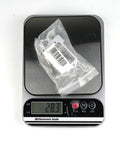 Pro Grade RC Drone Airdrop Release Gear With 25T Servo Arm on electronic scale showing weight