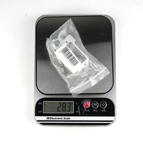 Pro Grade RC Drone Airdrop Release Gear With 25T Servo Arm on electronic scale showing weight