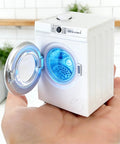 Straight Out The Box This 1:12 Scale Miniature Washer Rocks A Real Spinning Drum And Flip Top Lid Hitting Dead On Realism For Your Dollhouse Setup And Killing It For Custom Micro Landscape Diorama Projects, held in a hand with vibrant blue interior.