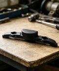 Luggage Repair Button And Replacement Pull Handle Fix Broken Suitcase Grips With Ease Solid black plastic handle on workbench.