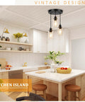 Slick Three Light Black Pendant Fixture With Crystal Clear Glass Shades and Fully Adjustable Suspension Cords above kitchen island.