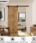 Room with 79.2 Inch Sliding Barn Door Hardware Kit With Adjustable U Shape Floor Guide, Wall Mount Rail, splicing track visible, door installed.
