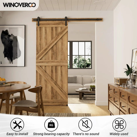 Room with 79.2 Inch Sliding Barn Door Hardware Kit With Adjustable U Shape Floor Guide, Wall Mount Rail, splicing track visible, door installed.