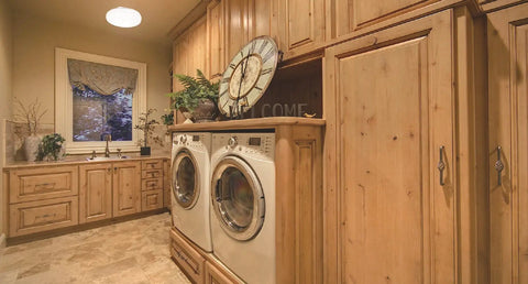 Laundry room with wooden cabinets and washer-dryer under a 14 Inch Round LED Flush Mount Ceiling Light, Low Profile Modern Fixture With Dimmable 4000K Cool White, Energy Efficient Home Lighting For Bathroom, Kitchen, Bedroom, Hallway, Closet, Easy Install.