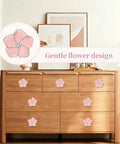 Top Shelf Pink Floral Cabinet Knobs And Drawer Pulls Set Of Four Damn Cute Petal Handles on a wooden dresser.