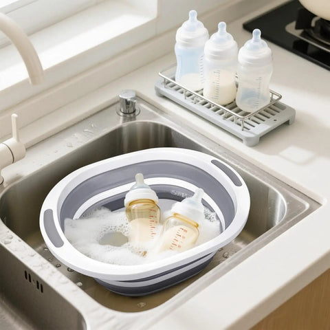 Collapsible Wash Basin 7.5L Dish Tub Sink Basin Folding Dish Pan With 2-In-1 Dish Pan And Cutting Board with baby bottles in sink