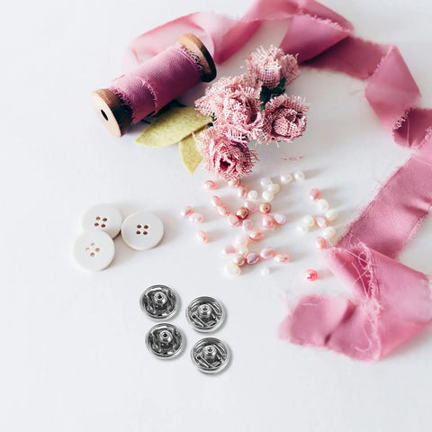 120 Pcs Silver Metal Snap Fasteners 6mm Mini Sew On Button Closures for Clothes, surrounded by pink flowers and ribbons