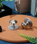 Two Pack Stainless Steel Suction Cup Handles displayed on a surface, modern sleek design, ideal for glass shower doors and cabinets, no drilling required.