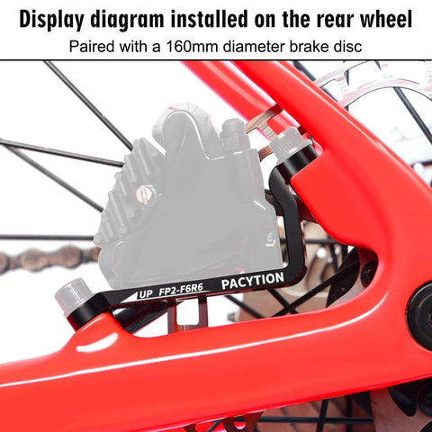 Disc Brake Adapter 160mm For Front And Rear Calipers installed on rear wheel with 160mm rotor on red bike frame.