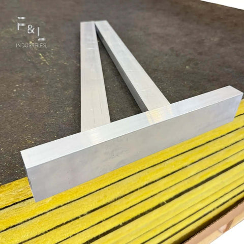 Heavy Duty Aluminum Square Duct Angle Cutting Guide With Exact 15 Degree And 22.5 Degree Markings, shown on a stack of duct boards