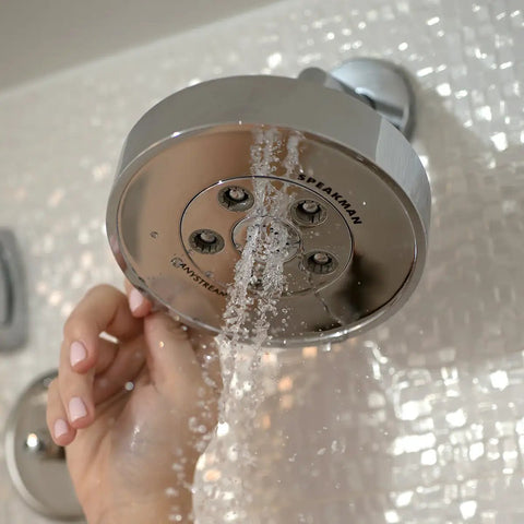Neo Anystream High Pressure Adjustable Shower Head 2.5 GPM Polished Chrome with Custom Spray Patterns being adjusted by hand