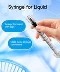 1ml Luer Lock Syringe Without Needle Pack Of 30 Sterile Plastic Syringes Individually Sealed For Lab Use Plant Cultivation Classroom Demos And Home Projects With Leakproof Top Luer Lock Smooth Plunger And Clear Markings, hand holding capped syringe