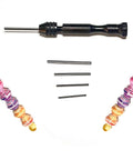 Black Paper Bead Roller With Four Interchangeable Stainless Slotted Tips for Tiny Bead Holes, shown with colorful paper beads.