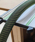 Precision Right Angle Track Saw Square Guide For Instant 90 Degree Plunge Saw Alignment Quick Setup Jig compatible with guide rails is shown with a green and black textured hose.