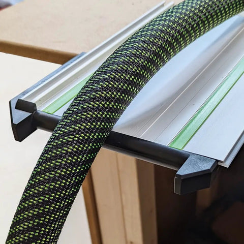 Precision Right Angle Track Saw Square Guide For Instant 90 Degree Plunge Saw Alignment Quick Setup Jig compatible with guide rails is shown with a green and black textured hose.