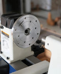 Heavy Duty 1x8Tpi Face Plate Kit For Woodturning Lathes Including 2 3 4 And 6 Inch Plates mounted on a lathe, showcasing steel plate and machinery details.