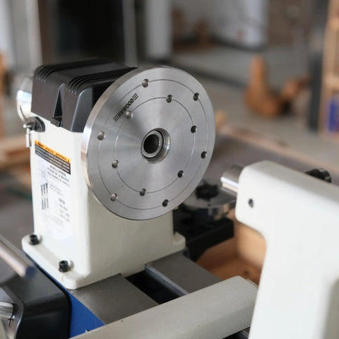 Heavy Duty 1x8Tpi Face Plate Kit For Woodturning Lathes Including 2 3 4 And 6 Inch Plates mounted on a lathe, showcasing steel plate and machinery details.