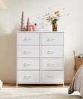 Versatile Fabric Dresser With 8 Bin Chest Organizer And Fabric Storage Tower in bedroom setting, wooden top with decor items