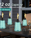 Four Pack Refillable Table Top Citronella Torches With Glass Canisters 12 Oz Each Blue Outdoor Lighting on patio table