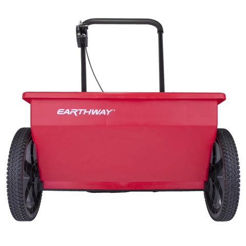 Red 75Lb Drop Spreader for Lawn Care With 22 Inch Coverage, front view showing wheels and handle, adjustable flow