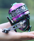Colorful spincast fishing reel with high speed three point nine to one gear ratio, push button bait cast design, reversible handle.