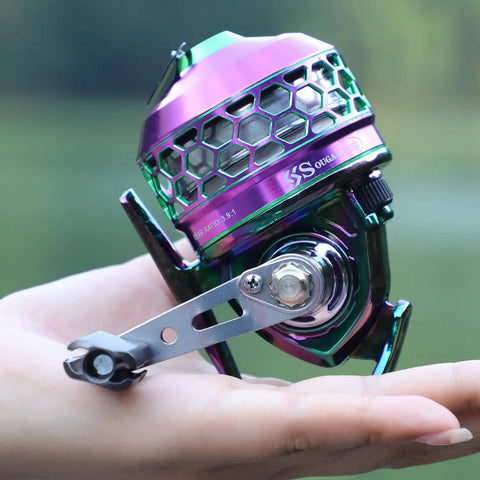 Colorful spincast fishing reel with high speed three point nine to one gear ratio, push button bait cast design, reversible handle.