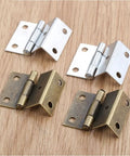 Dope Zinc Alloy Cabinet Hinges Set with Antique Bronze and Silver Finish, 4 decorative hinges on wood surface, close-up view