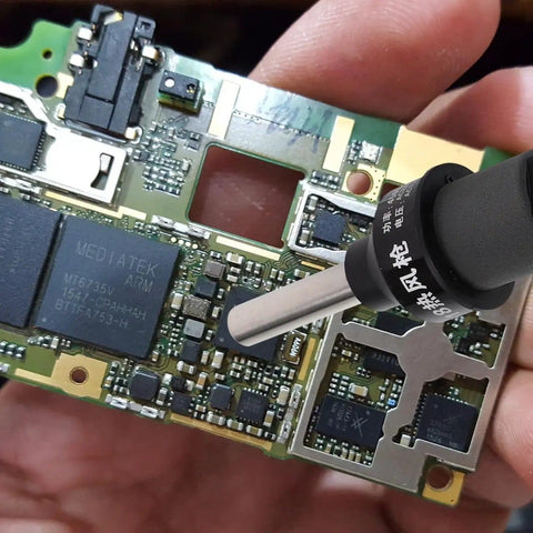 Circuit board being soldered using 110V LCD Display Soldering Station And Portable Hot Air Gun For Desoldering in hand.