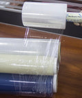 Top Shelf Clear Stretch Wrap 6 Inch By 1000 Feet Plastic Roll for Moving and Shipping Heavy Duty Shrink Film on a wooden table.
