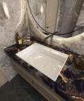 Bathroom countertop with Black Marble Peel And Stick Contact Paper With Gold Veins Removable Matte Finish near sink faucet.