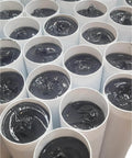 Open tubes of Premium High Temp Gray And Black Number One Lithium Complex Grease Pack Twenty 14 Ounce Tubes In Two Boxes