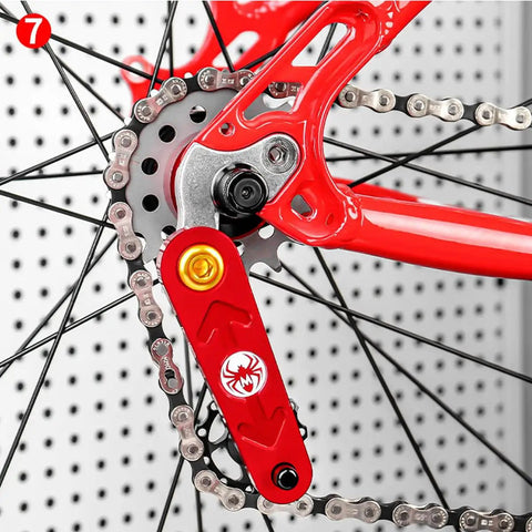 Close-up view of bike chain and red part with spider logo on a Single Speed Freewheel For Mountain Bikes 12T Gear Sprocket Beefy Steel Construction Easy Index Shifting Smooth Ride Durable Replacement Freewheel Part For Upgrading Your Mountain Bike.