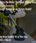 Installed trolling motor stabilizer kit on Minn Kota; black low-profile base with adjustable aluminum rod.